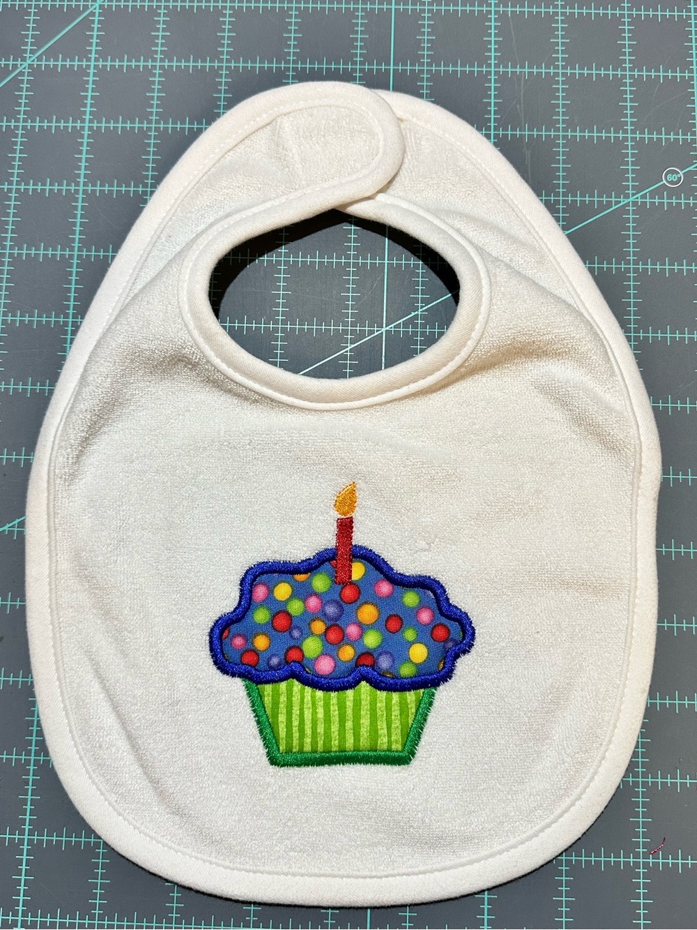 White embroidery appliqué Baby Bib with Colorful Cupcake